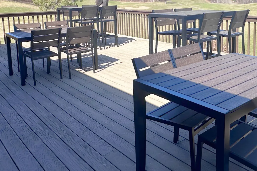 Outdoor deck seating at the Golden Eagle clubhouse overlooking the 9th green