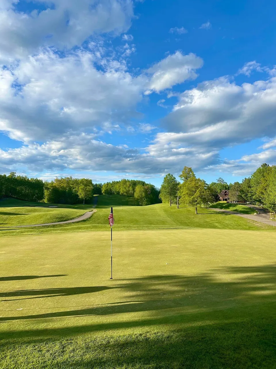 Course landscape with rolling fairway and approach bunkers